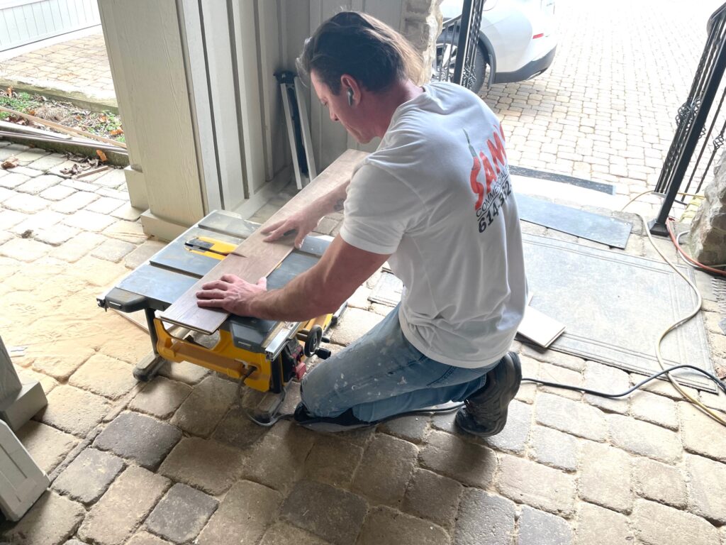Carpenter prepares wooden flooring