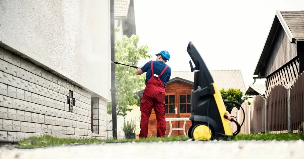 Residential exterior painting preparation with pressure washing