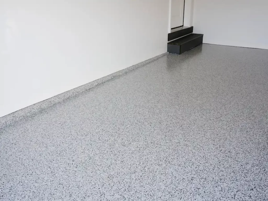Garage epoxy flooring with decorative flakes before winter