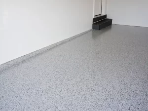 Epoxy garage floor coating with decorative flakes before winter