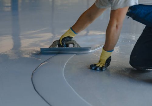 Applying gray epoxy resin to the new floor