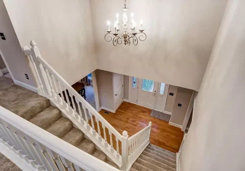 White staircase in large home